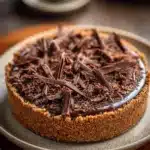 Close-up of a no-bake chocolate cake with glossy texture and clean background