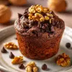 Close-up of delicious chocolate muffin mix with rich textures and warm lighting.