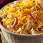 Close-up of a corn chicken casserole with golden crust and creamy texture.