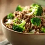 Close-up of a savory beef dish garnished with herbs, showcasing a high protein beef dinner.