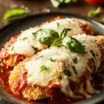 Close-up of high protein chicken parmesan with melted cheese and tomato sauce