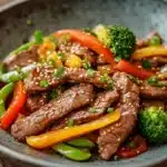 Close-up of a savory beef dish with high contrast and sharp textures, perfect for a high protein dinner.