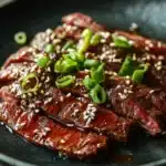 Close-up of high protein Korean BBQ beef with a clean background and bright lighting.