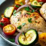 Close-up of a low calorie chicken bake with golden crust and herbs