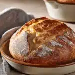 Close-up of a freshly baked no knead bread with a golden crust, no dutch oven needed