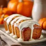 Close-up of pumpkin bread with vanilla pudding, showcasing its moist texture and golden crust.