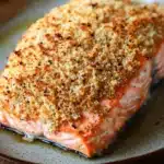 Close-up of crispy air fryer salmon with panko crust on a white plate