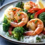 Close-up of air fryer shrimp dinner with bright, natural lighting and minimal background.