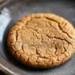 Close-up of chewy cookie butter cookies with a golden brown texture on a clean background.