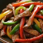 Close-up of crock pot beef pepper steak with vibrant colors and appetizing textures