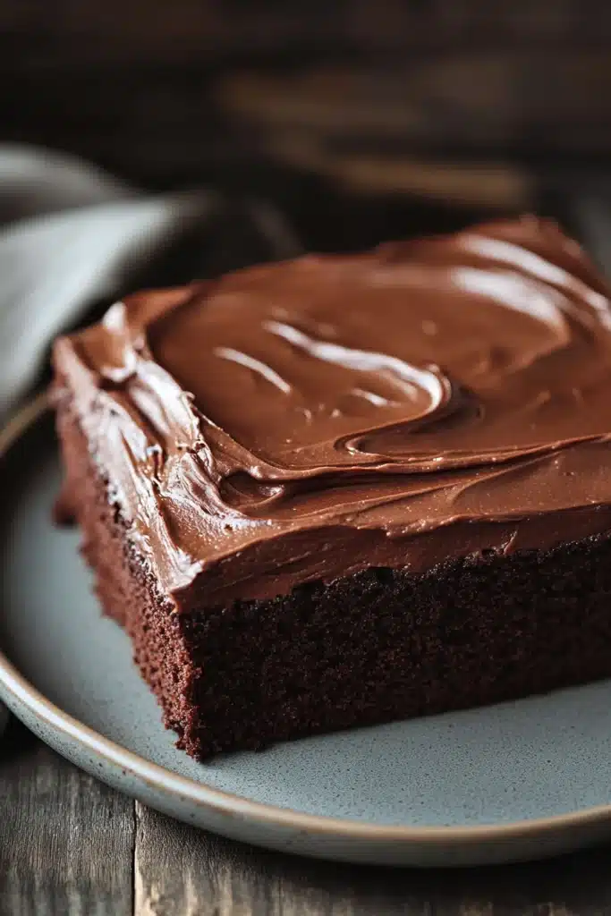 Close-up of a delicious sheet cake with a smooth frosting and decorative toppings.