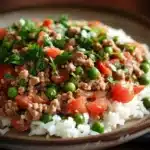 Close-up of a delicious ground turkey and rice dish with vibrant colors and textures.