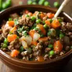 Close-up of a hearty ground beef crockpot dish with bright natural lighting