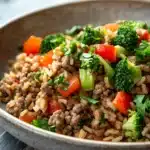 Close-up of a high protein beef rice dish with vibrant colors and appetizing presentation.