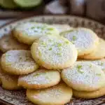 Close-up of key lime shortbread cookie with a light, crumbly texture and a hint of lime zest.