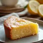 Close-up of a lemon cake without frosting, showcasing its texture and vibrant color.