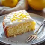Close-up of a lemon cake with lemon yogurt on a clean background