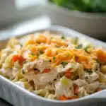 Close-up of a low calorie chicken noodle casserole with creamy sauce and noodles.