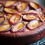 Close-up of a delicious plum cake allo yogurt from Giallo Zafferano with a golden crust and moist texture.