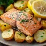 Close-up of a salmon potato dinner with bright lighting and clean background