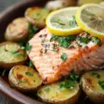 Close-up of a salmon and potato dinner with bright lighting and clean background