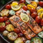 Close-up of sheet pan salmon and vegetables with bright colors and clean presentation