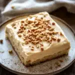 Close-up of a delicious peanut butter zucchini sheet cake with a creamy topping