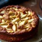 Close-up of a freshly baked apple cake with a golden crust, perfect for toddlers.